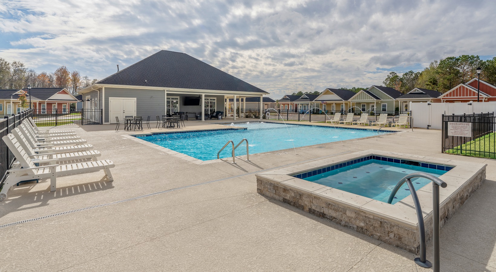 Resort-style pool with hot tub at Cottages Dothan in Dothan, AL