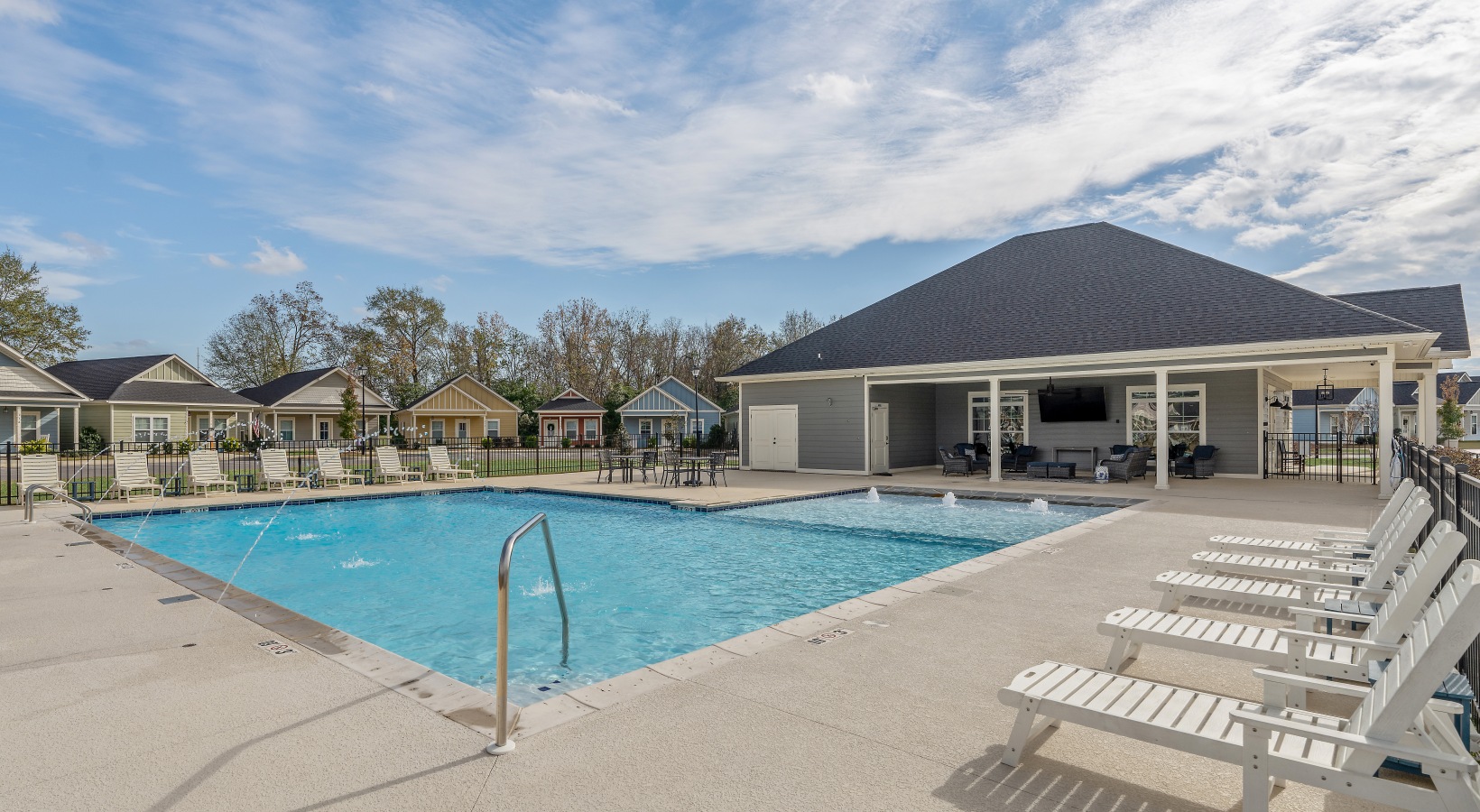 Resort-style pool and sundeck at Cottages Dothan in Dothan, AL