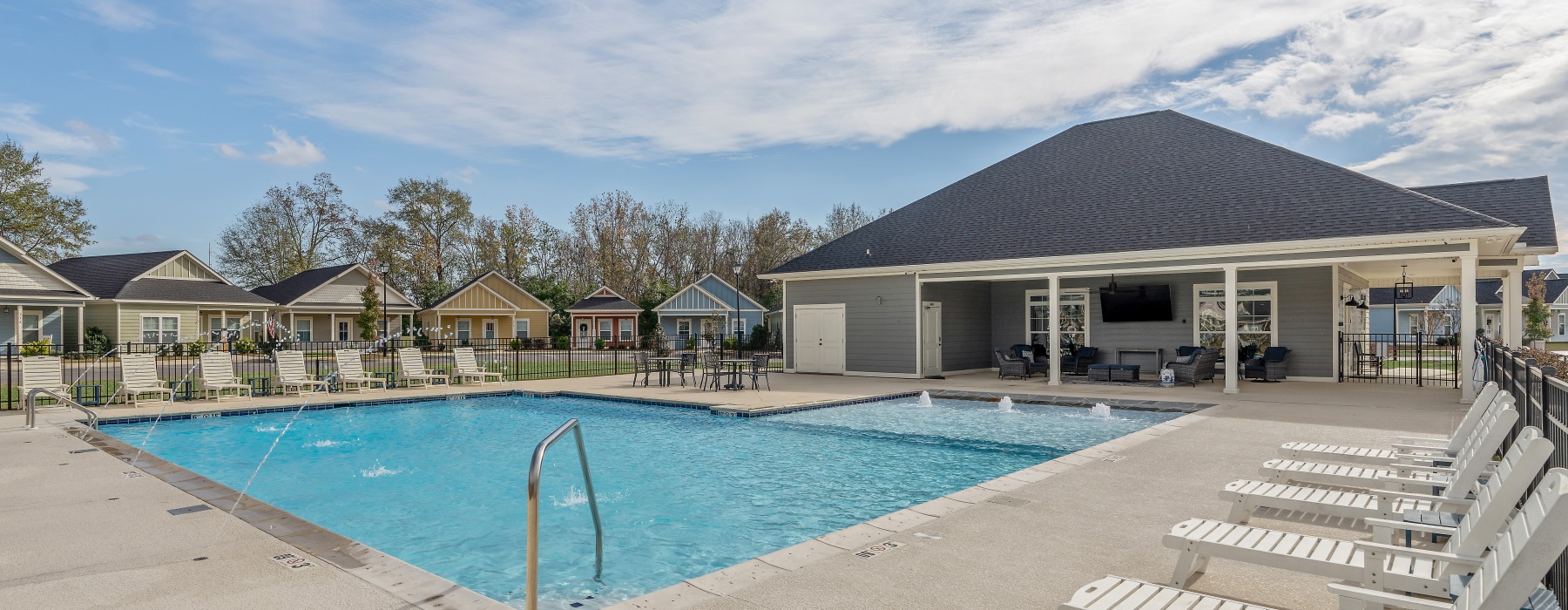 Resort-style pool and sundeck at Cottages Dothan in Dothan, AL